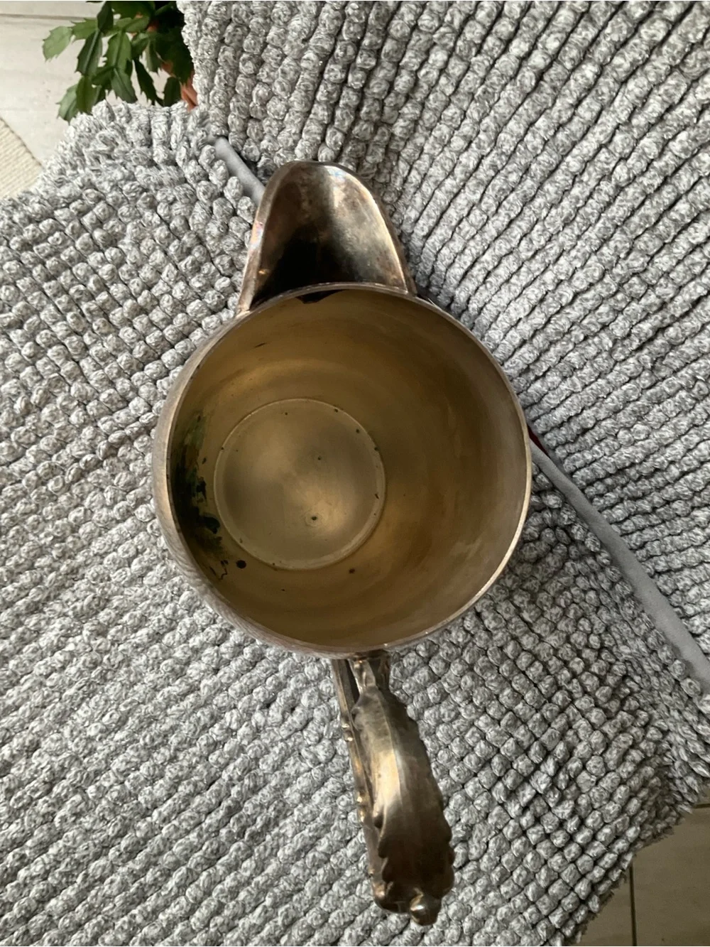 Polished Silver-Tone Decorative Metal Pitcher with Ornate Handle